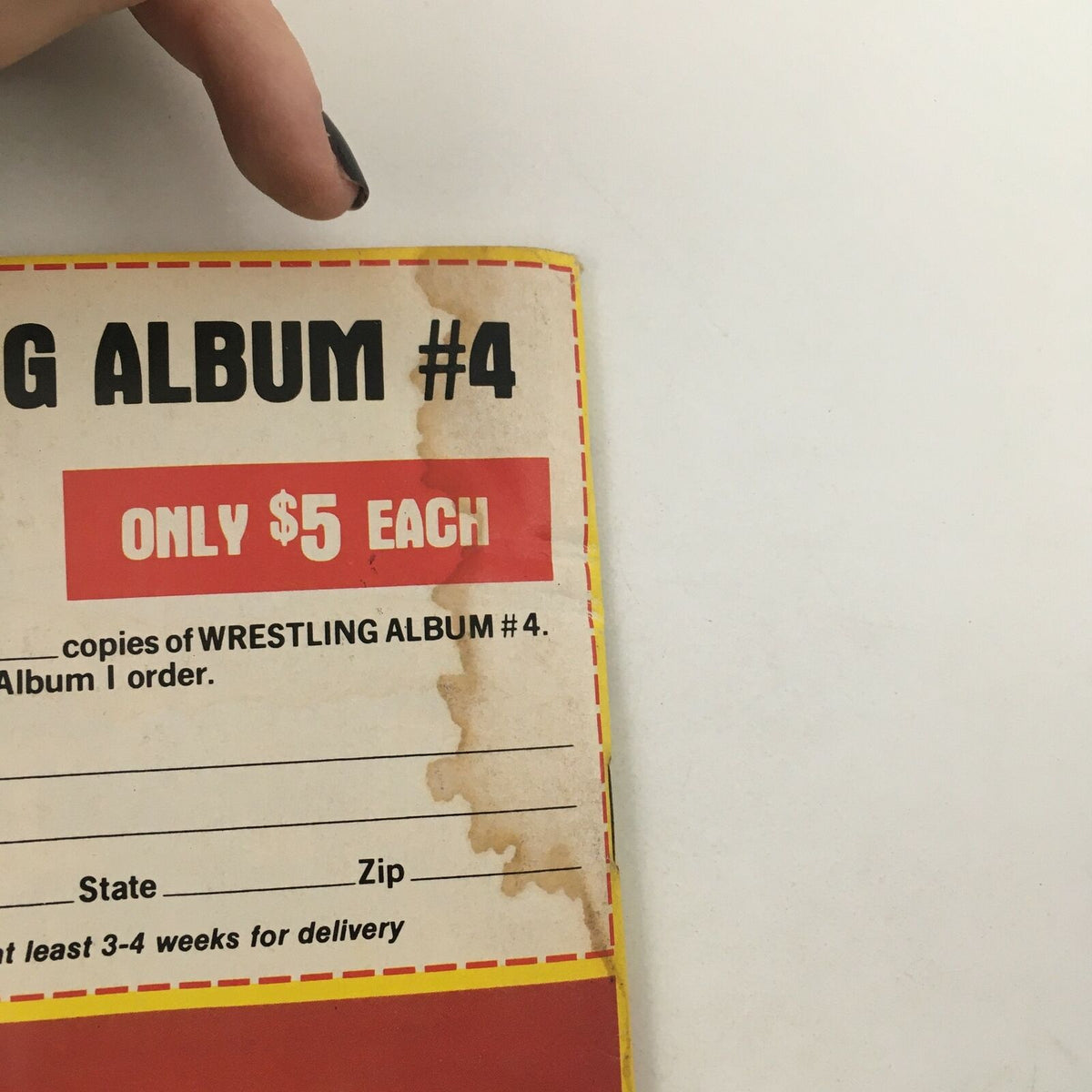 Close-up of Wrestling Album #4 promotional page displaying the price and ordering details, highlighting its availability exclusively through mail order for wrestling fans.