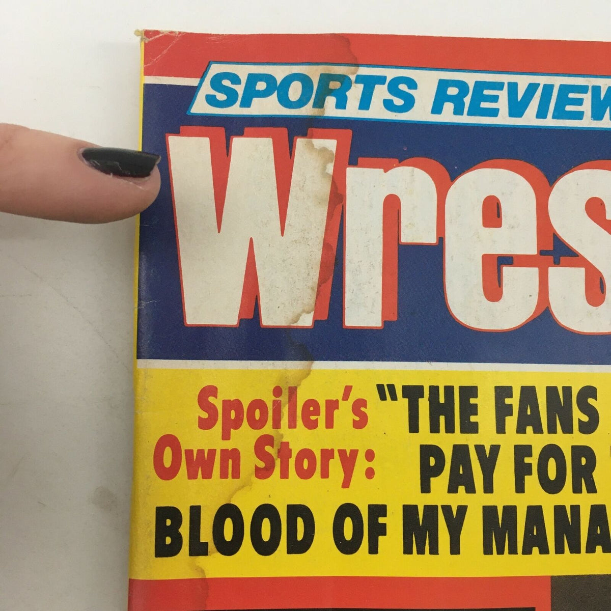 Detail of the Sports Review Wrestling Magazine April 1982 cover showing the title and a promotional tease, featuring the story of Spoiler, enhancing the nostalgic appeal of vintage wrestling publications.