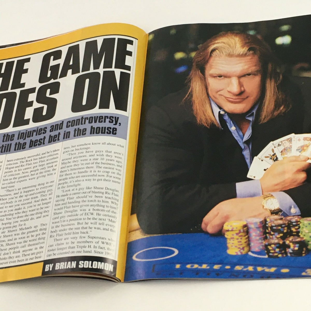 Feature article page in WWE Raw Magazine May 2003 titled 'The Game Does On', focusing on Triple H with themes of betting and wrestling injuries.