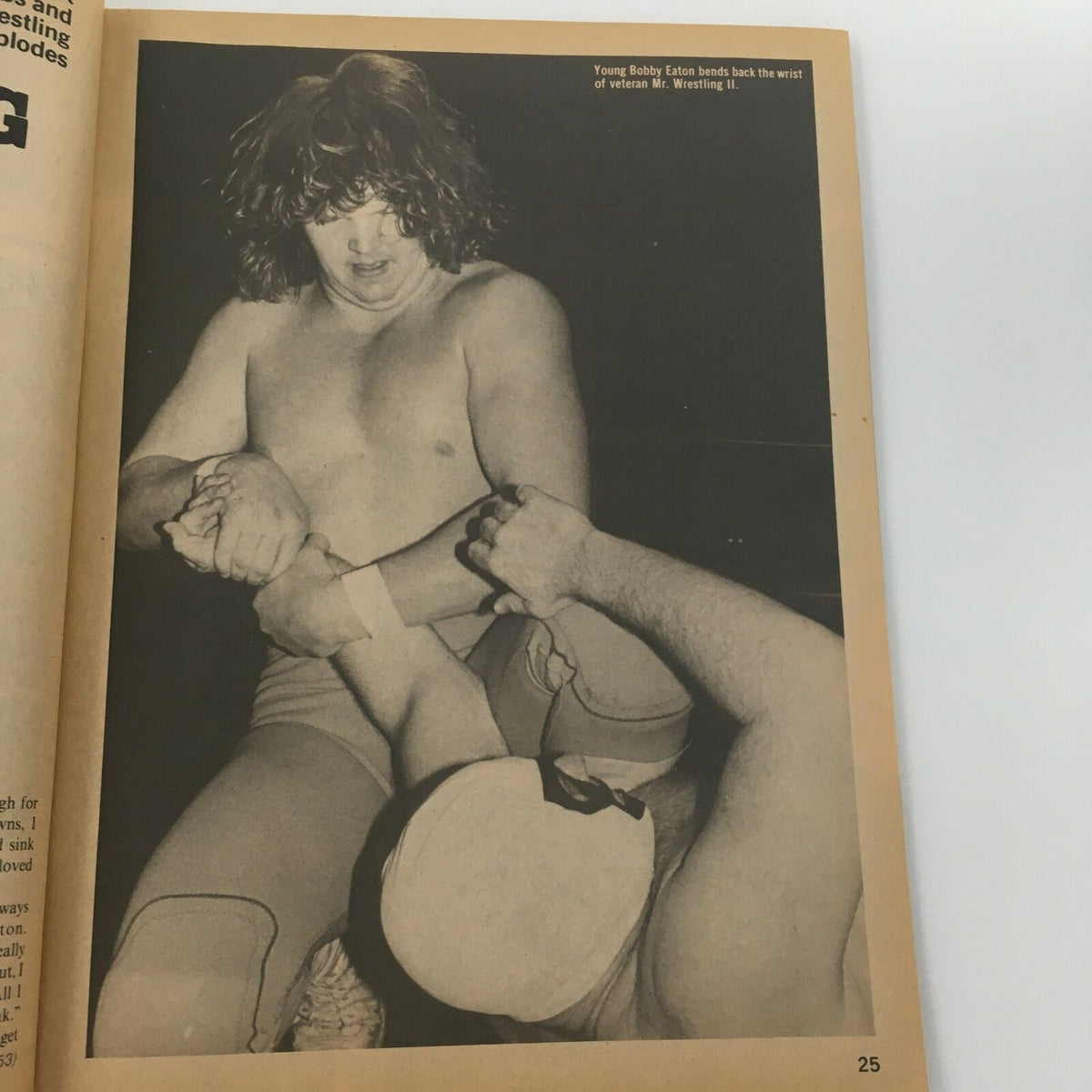 Black and white image inside The Wrestler Magazine August 1981 featuring Bobby Eaton in a wrestling match, showcasing classic grappling techniques.