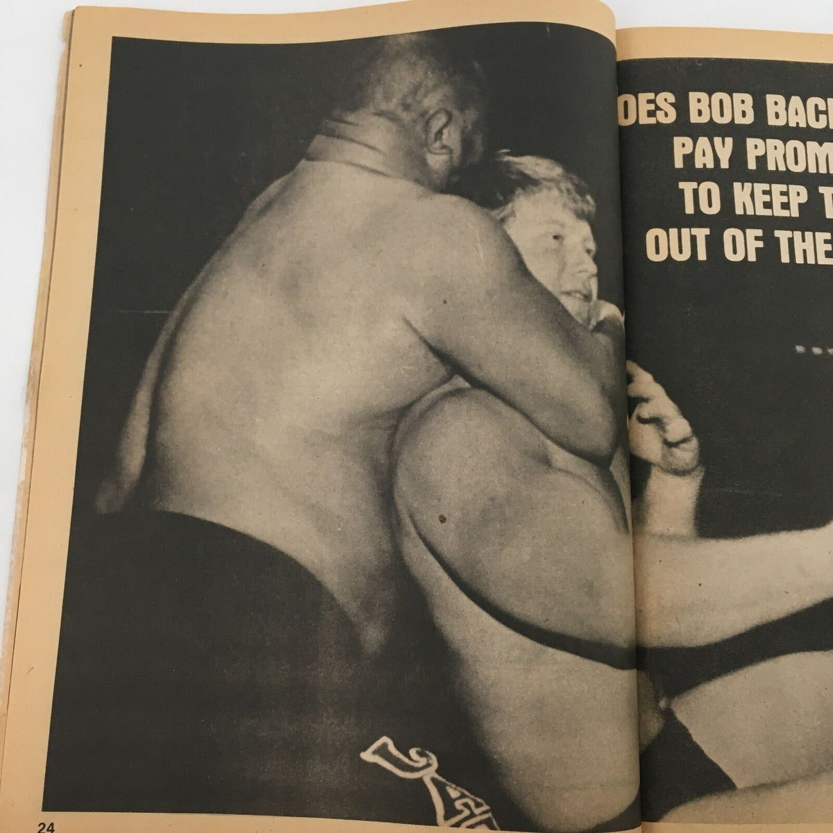 Page from Sports Review Wrestling Magazine Summer 1980 featuring a wrestling match scene and the question regarding Bob Backlund's promotional tactics.