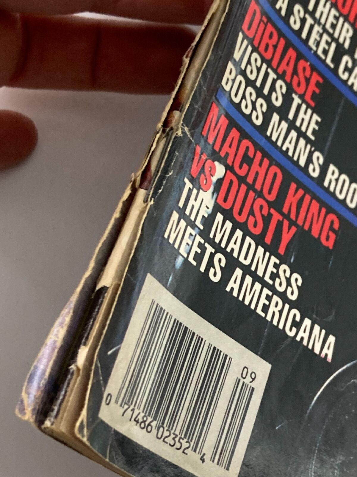 Close-up view of the spine of WWF Magazine September 1990, revealing the issue title and its condition, ideal for collectors interested in vintage wrestling memorabilia.