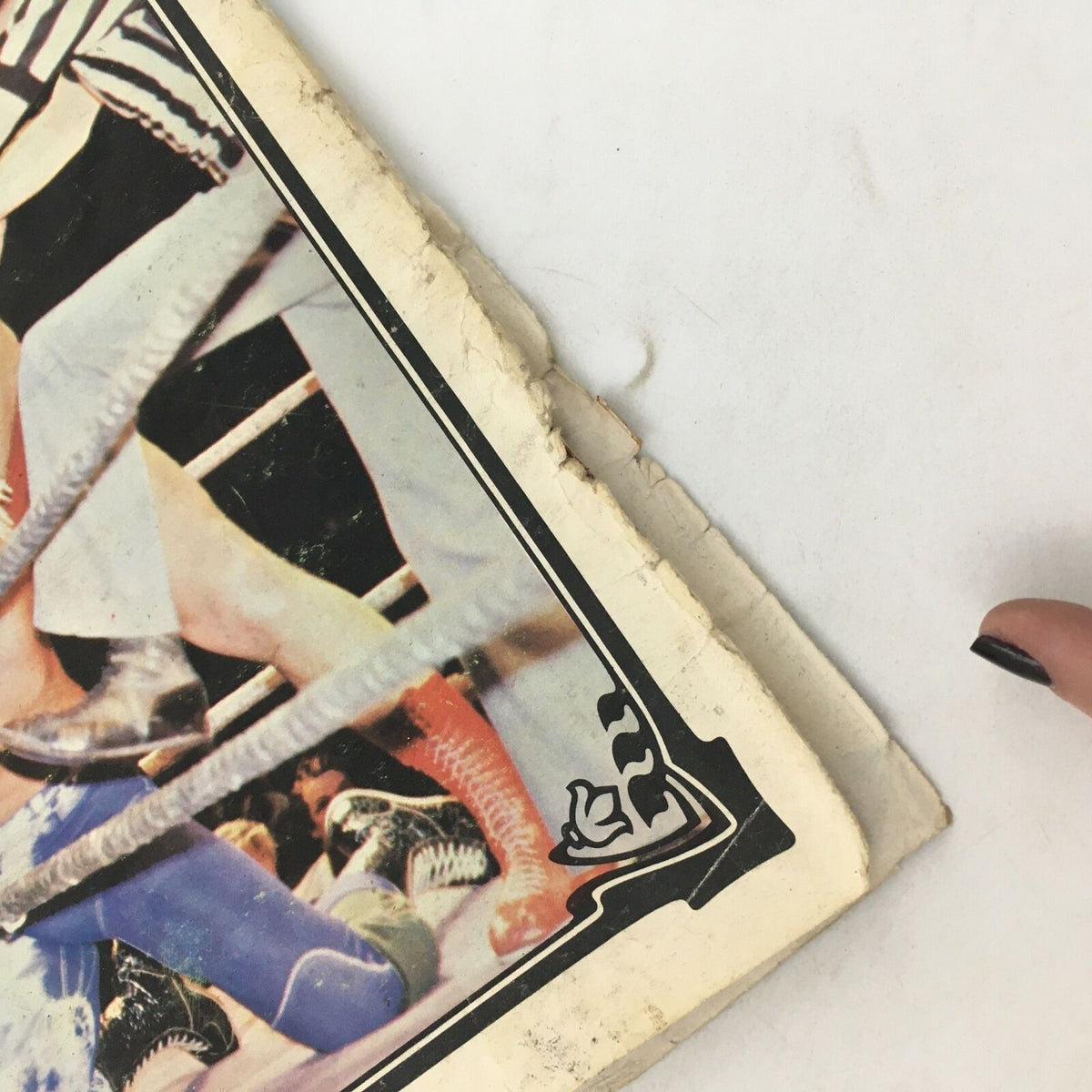 Wrestling Action Magazine Vol 1 #4 - Close-up of the magazine's damaged cover edge, reflecting its age and character, available in acceptable condition for collectors.