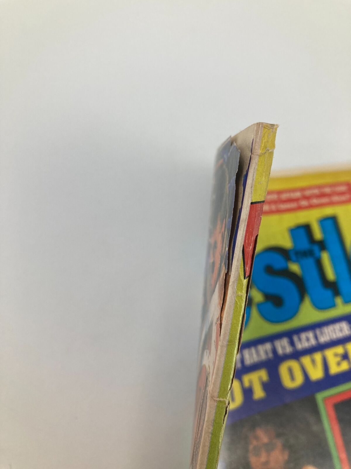 Side view of The Wrestler Magazine, November 1993, showcasing its vintage wear and tear, emphasizing its collectible nature for wrestling enthusiasts.