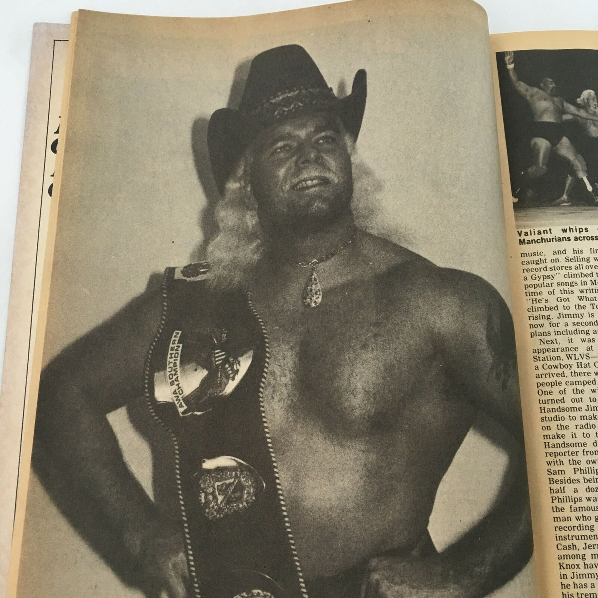 Black and white photo of a wrestler wearing a championship belt from The Ring's Wrestling Magazine February 1981.