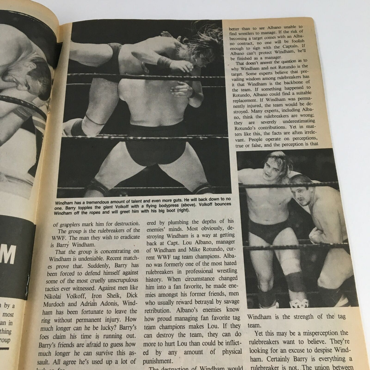 A wrestling action shot in The Wrestler Magazine June 1985, illustrating Barry Windham in the ring against an opponent. Captures the intensity and drama of the wrestling match.