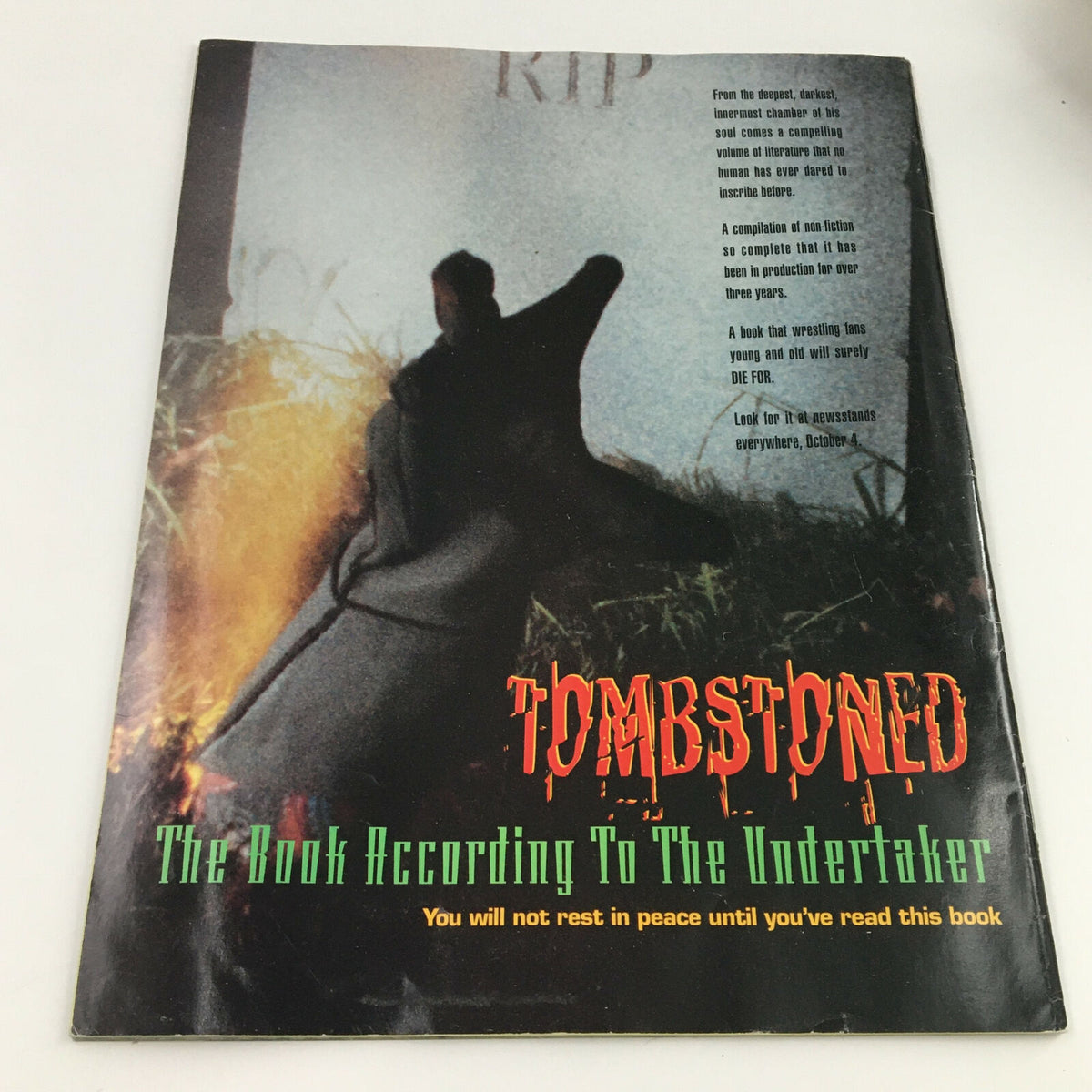 Cover page of the World Wrestling Federation Magazine October 1994 showcasing 'Tombstoned: The Book According To The Undertaker,' featuring eerie imagery and promotional text appealing to wrestling fans.