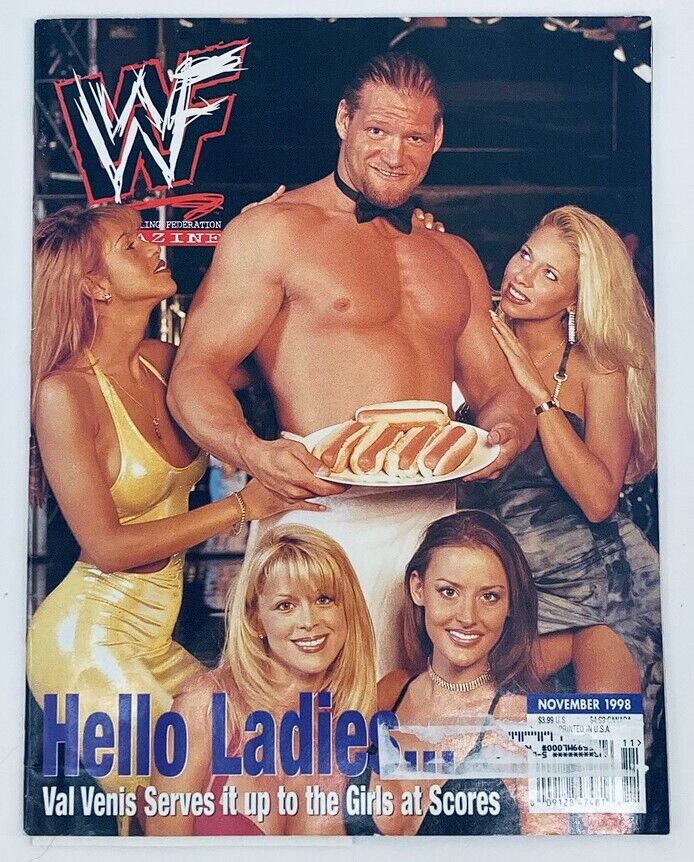 WWF World Wrestling Federation Magazine November 1998 cover featuring Val Venis posing with four women, showcasing a playful theme with Val in a tuxedo holding a plate of hot dogs, reflecting the entertainment style of professional wrestling from that era.