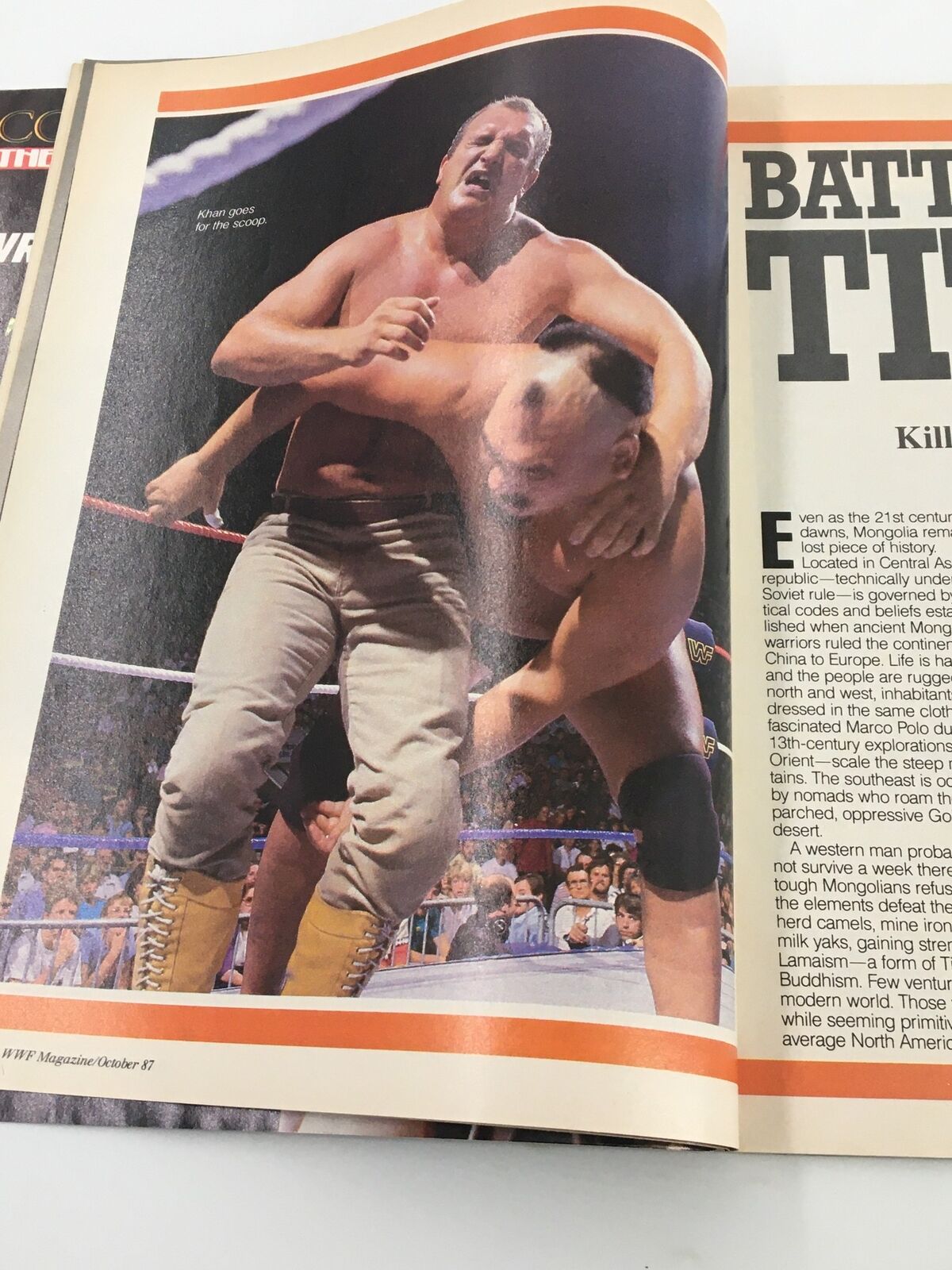 Action shot from VTG WWF Magazine October 1987 depicting a wrestling match between Killer Khan and Outback Jack, capturing the excitement of the sport.