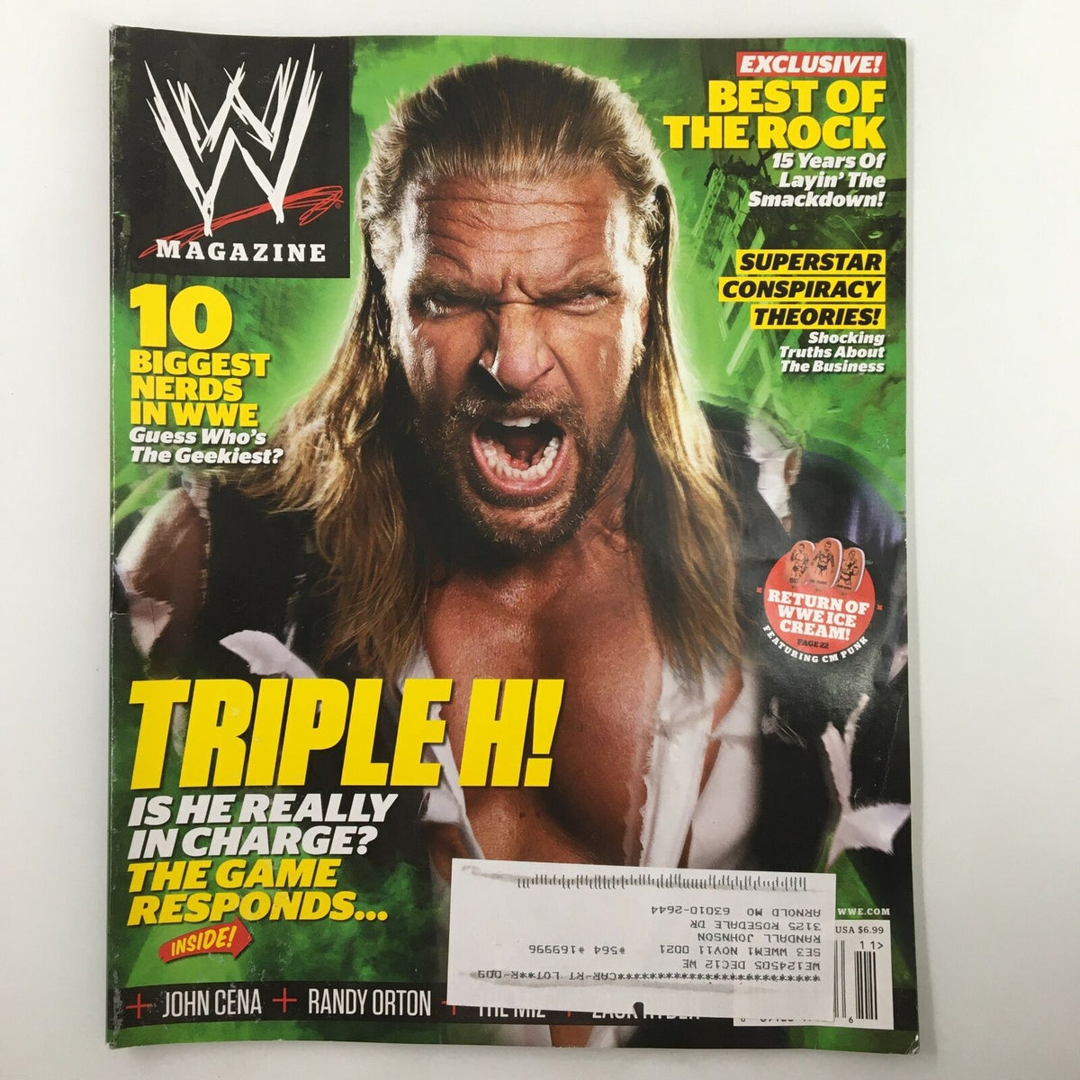 WWE Magazine November 2011 featuring Triple H on the cover with the headline "The Game Responds." The magazine highlights John Cena, Randy Orton, and includes an exclusive feature on the best of The Rock, offering a nostalgic look at WWE superstars and storylines.