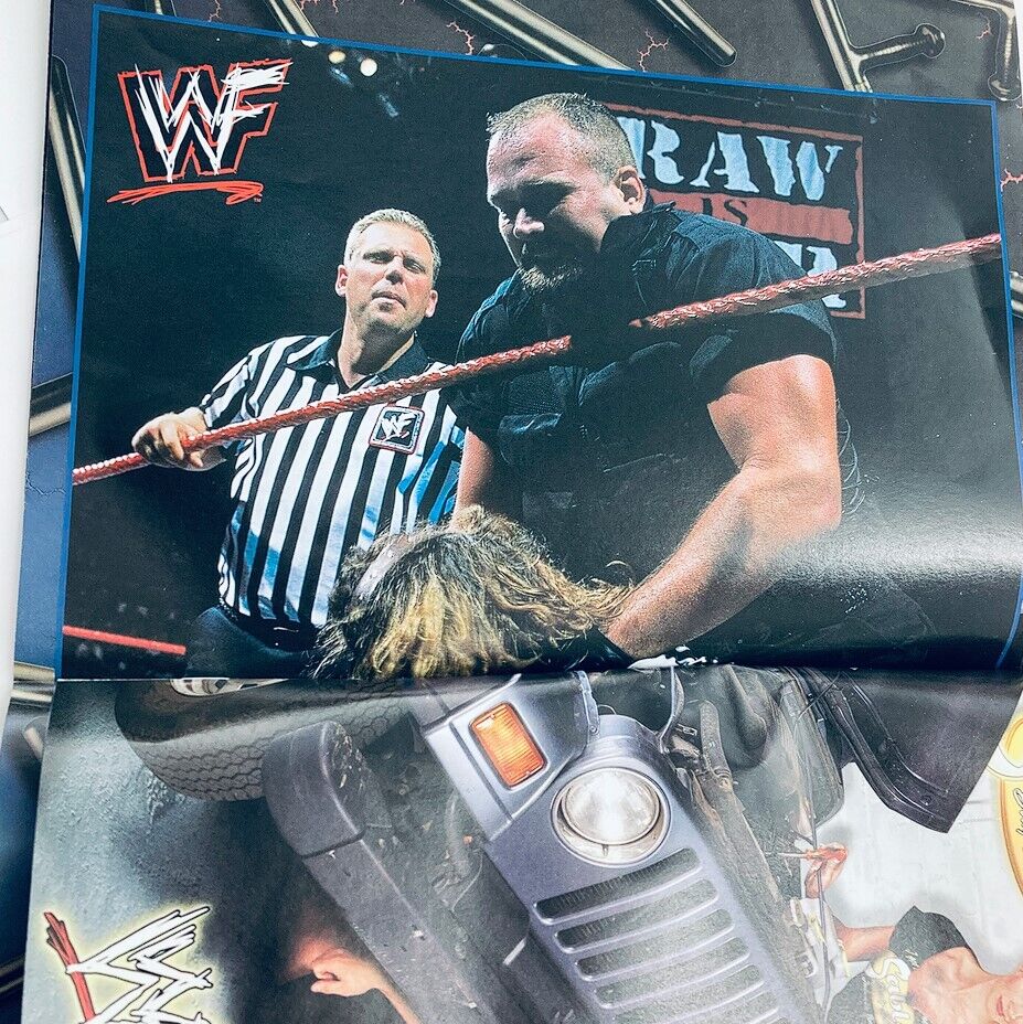Inside page of WWF World Wrestling Federation Magazine March 1999, depicting a wrestling match with a referee and wrestlers in action.
