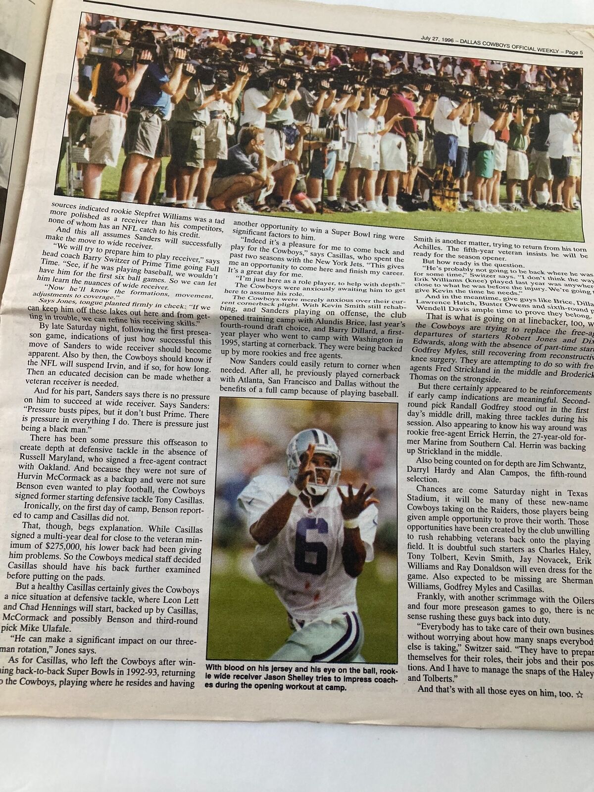 Dallas Cowboys Weekly Newspaper July 27 1996 Vol 22 #7 features a photo of fans at a football game capturing a moment during a training camp session.