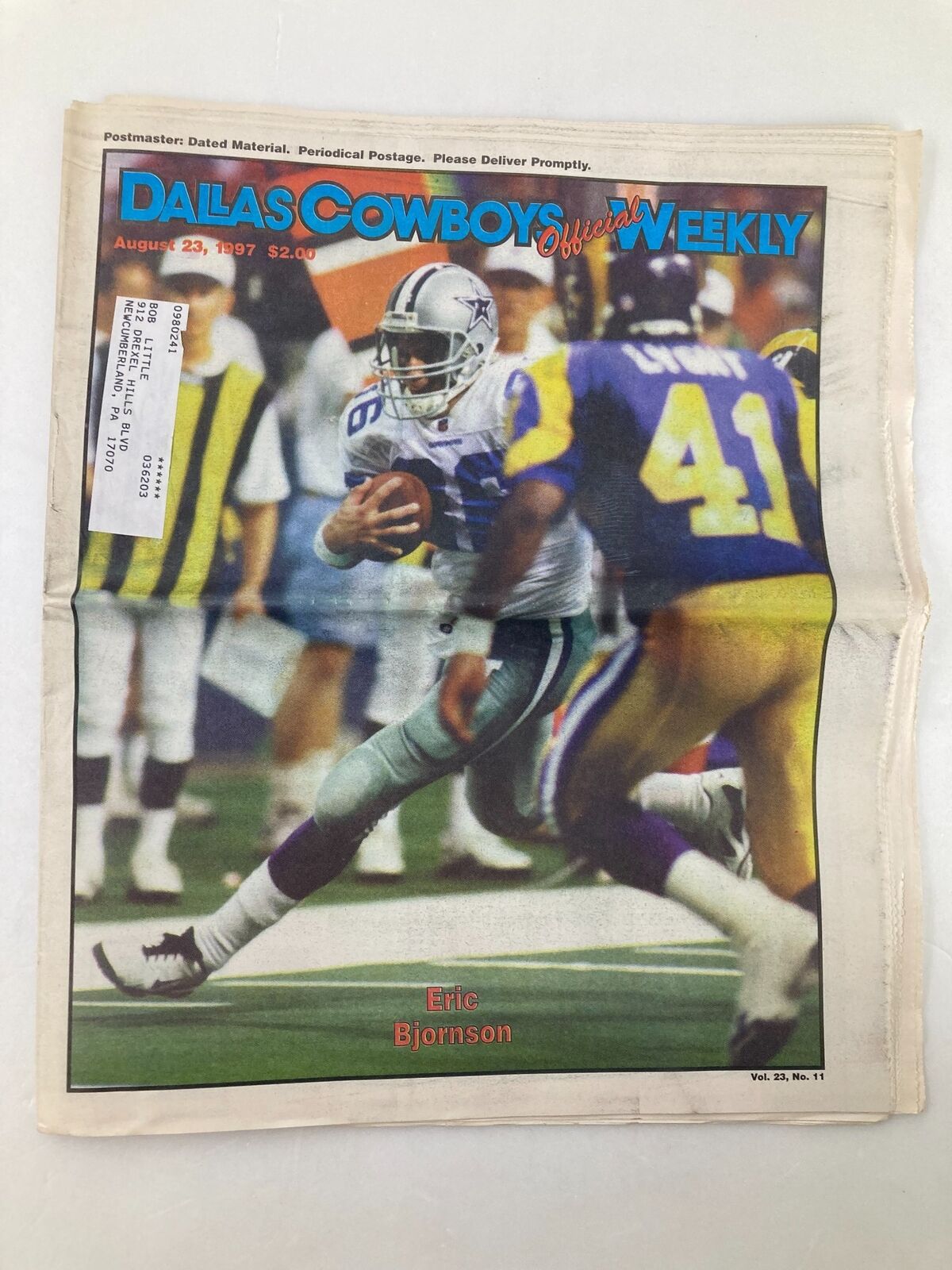 Dallas Cowboys Weekly Newspaper August 23, 1997 Vol 23 #11 featuring Eric Bjornson throwing a football on the cover.
