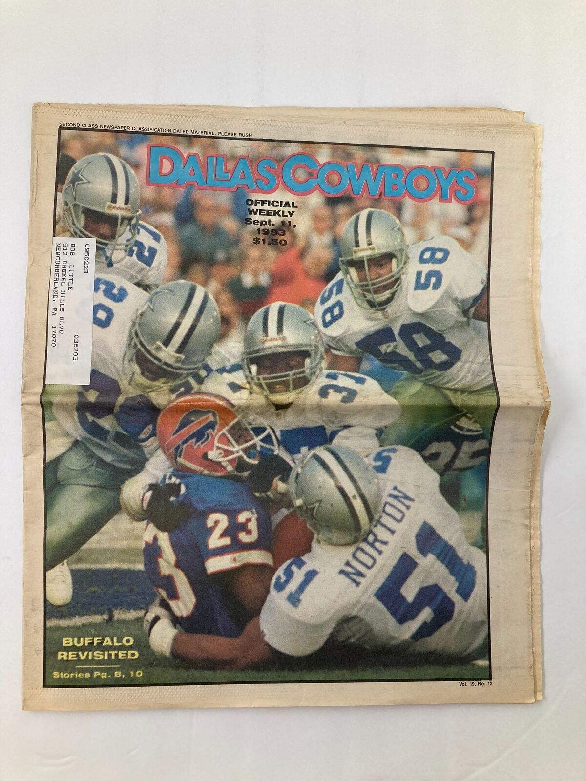 Dallas Cowboys Weekly Newspaper September 11 1993 Vol 19 #12 showcasing players in action during a game against the Buffalo team, highlighting fierce competition.