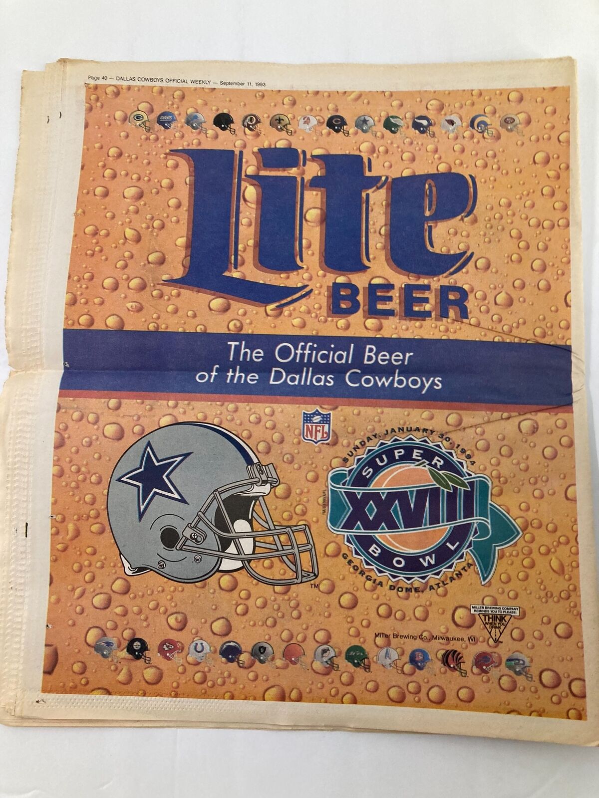 Dallas Cowboys Weekly Newspaper September 11 1993 Vol 19 #12 featuring an advertisement for Lite Beer, the Official Beer of the Dallas Cowboys, with a graphic of a football helmet and Super Bowl XXVIII logo.