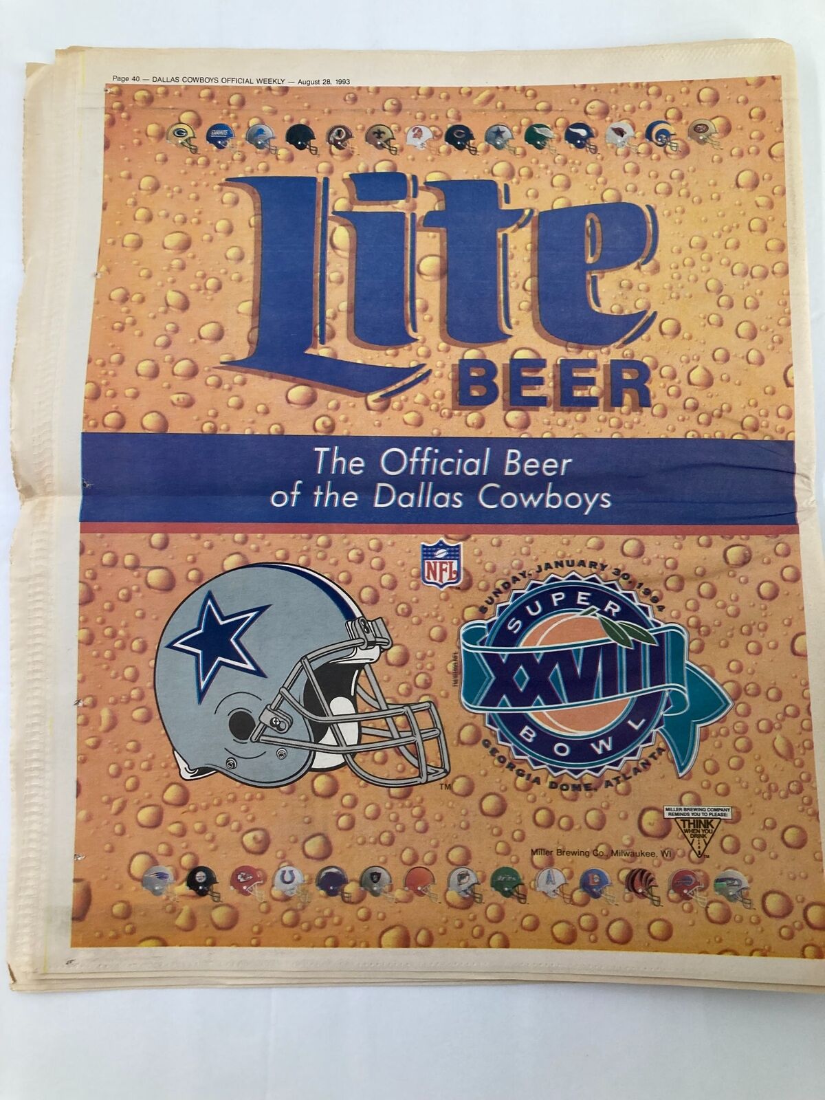 Dallas Cowboys Weekly Newspaper August 28 1993 Vol 19 #10 featuring Lite Beer advertisement, showcasing the official beer of the Dallas Cowboys and Super Bowl XXVIII branding. The image depicts a vibrant design with a football helmet and an assortment of logos.