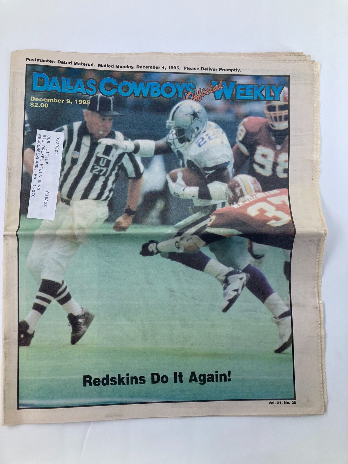 Dallas Cowboys Weekly Newspaper December 9 1995 Vol 21 #26 featuring Emmitt Smith with the headline 'Redskins Do It Again!' showing a Cowboys player on the field.
