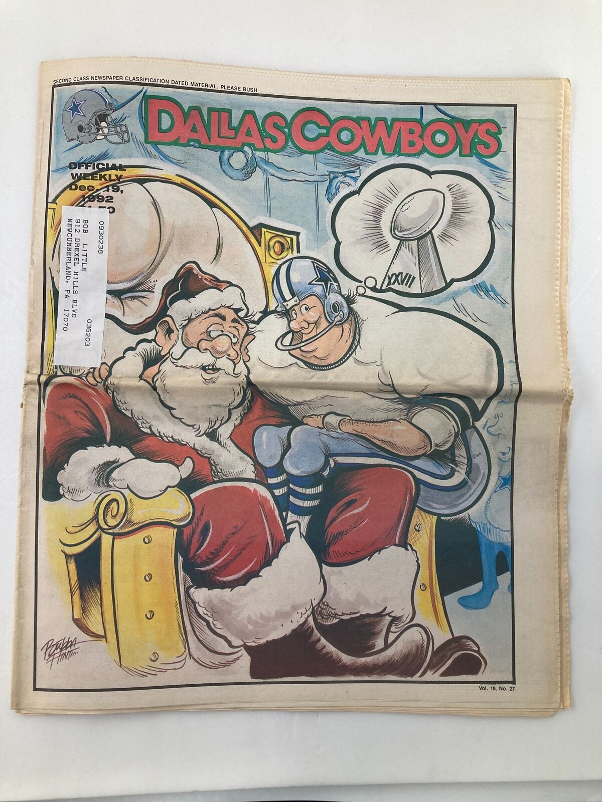 Cover of Dallas Cowboys Weekly Newspaper December 19, 1992 Vol 18 #27 featuring Santa Claus and a player, showcasing festive theme and cartoon illustrations.