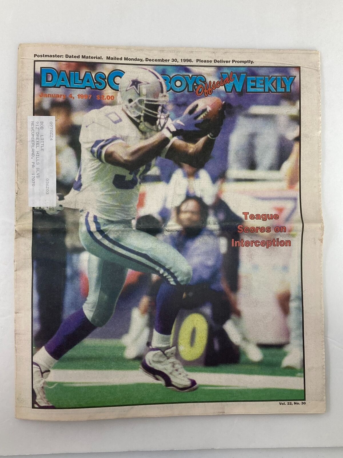 Dallas Cowboys Weekly Newspaper January 4 1997 Vol 22 #30 featuring George Teague on the cover, showcasing a player in action, celebrating a touchdown after an interception.