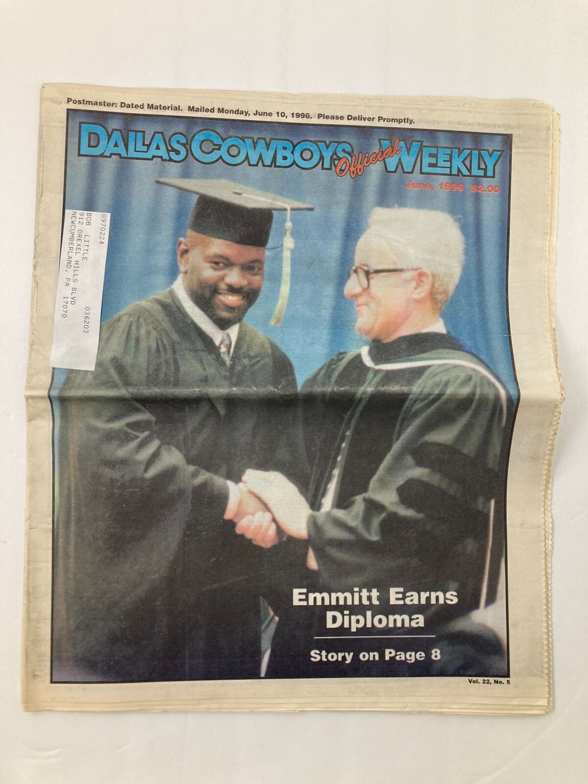Dallas Cowboys Weekly Newspaper June 1996 Vol 22 #5 featuring Emmitt Smith earning his diploma. The cover shows Emmitt Smith in a graduation cap and gown, smiling and shaking hands during the graduation ceremony.