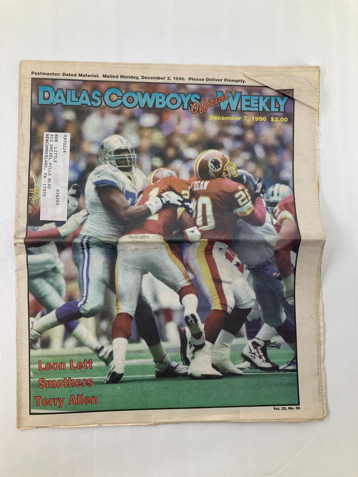 Dallas Cowboys Weekly Newspaper from December 7, 1996, featuring Leon Lett, Smothers, and Terry Allen on the cover. The newspaper shows a significant moment during a football game.