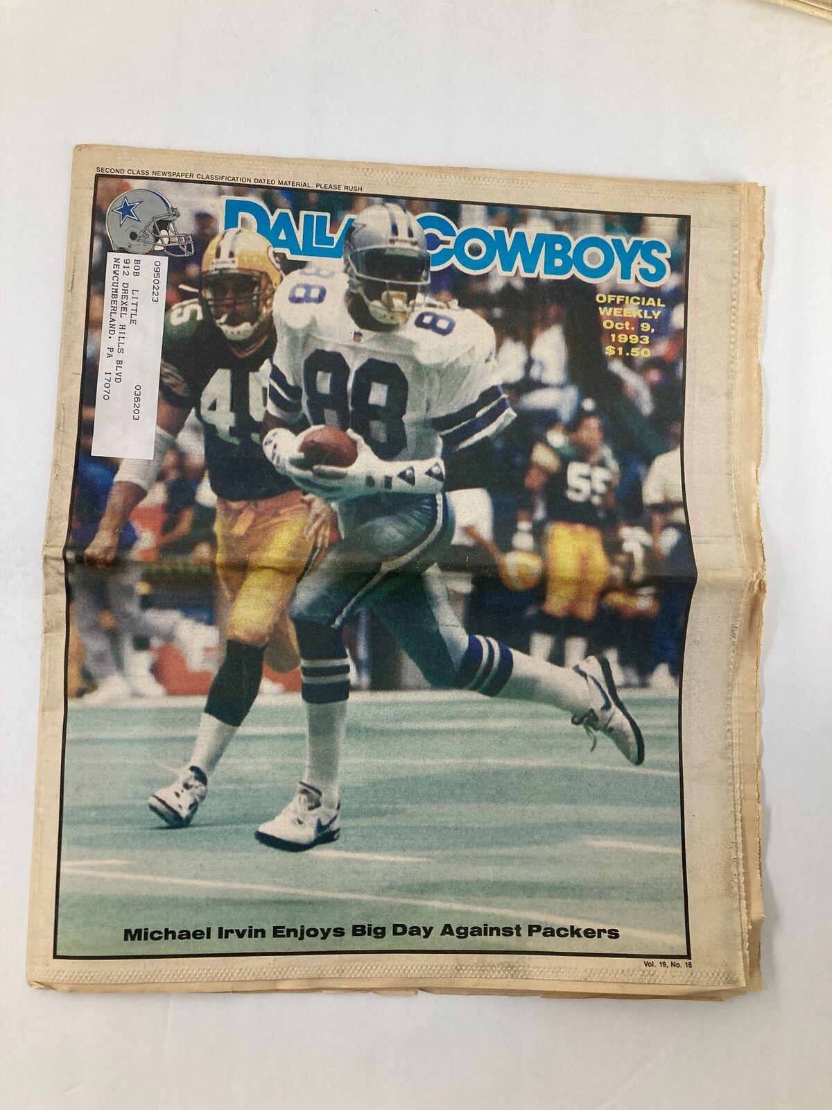 Dallas Cowboys Weekly Newspaper October 9 1993 Vol 19 #16 featuring Michael Irvin running with the football against the Green Bay Packers, showcasing a key moment from the game.