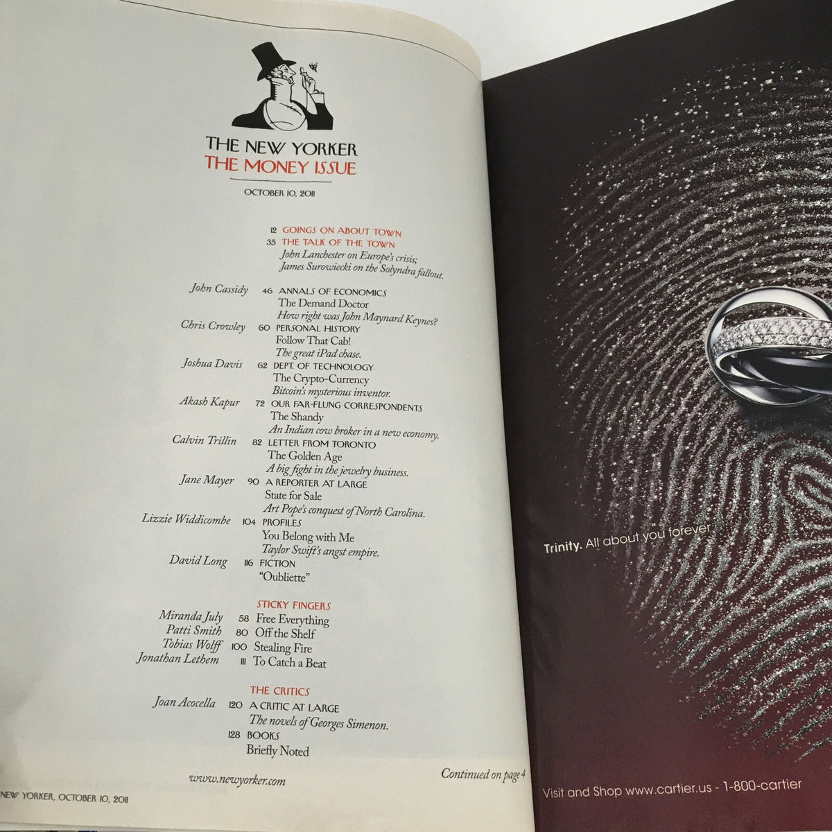 Inside page of The New Yorker Magazine from October 10, 2011 featuring articles from various writers, including a prominent spot for the first Bitcoin article, alongside an elegant ring advertisement.