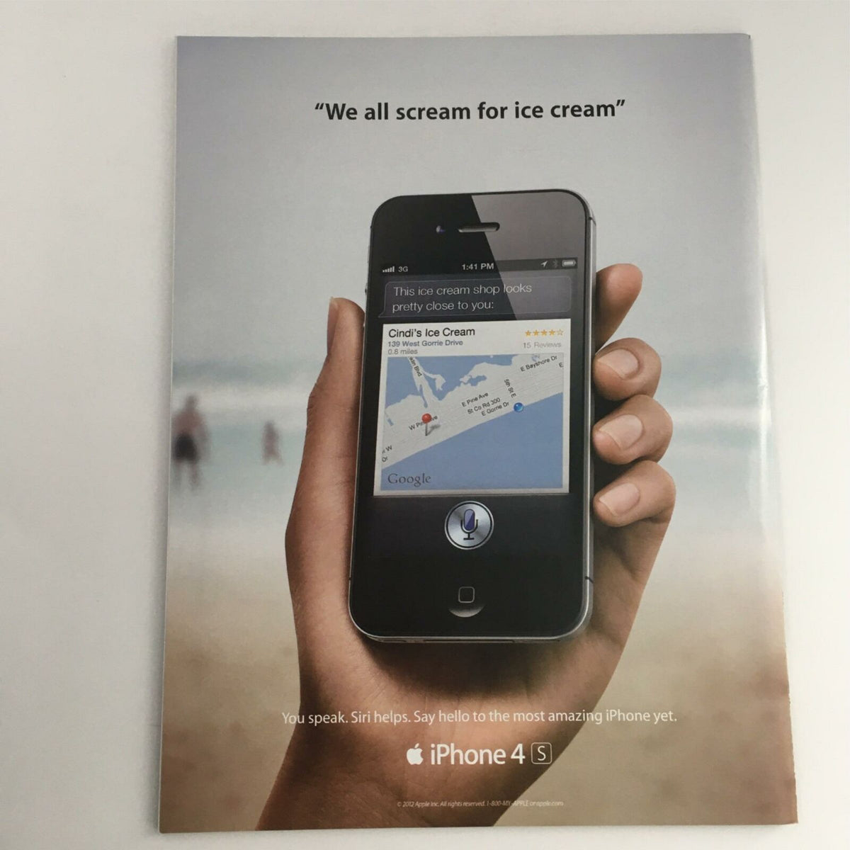 Promotional advertisement for iPhone 4S showcasing a hand holding the device with an ice cream shop mapping feature, demonstrating Siri capabilities.