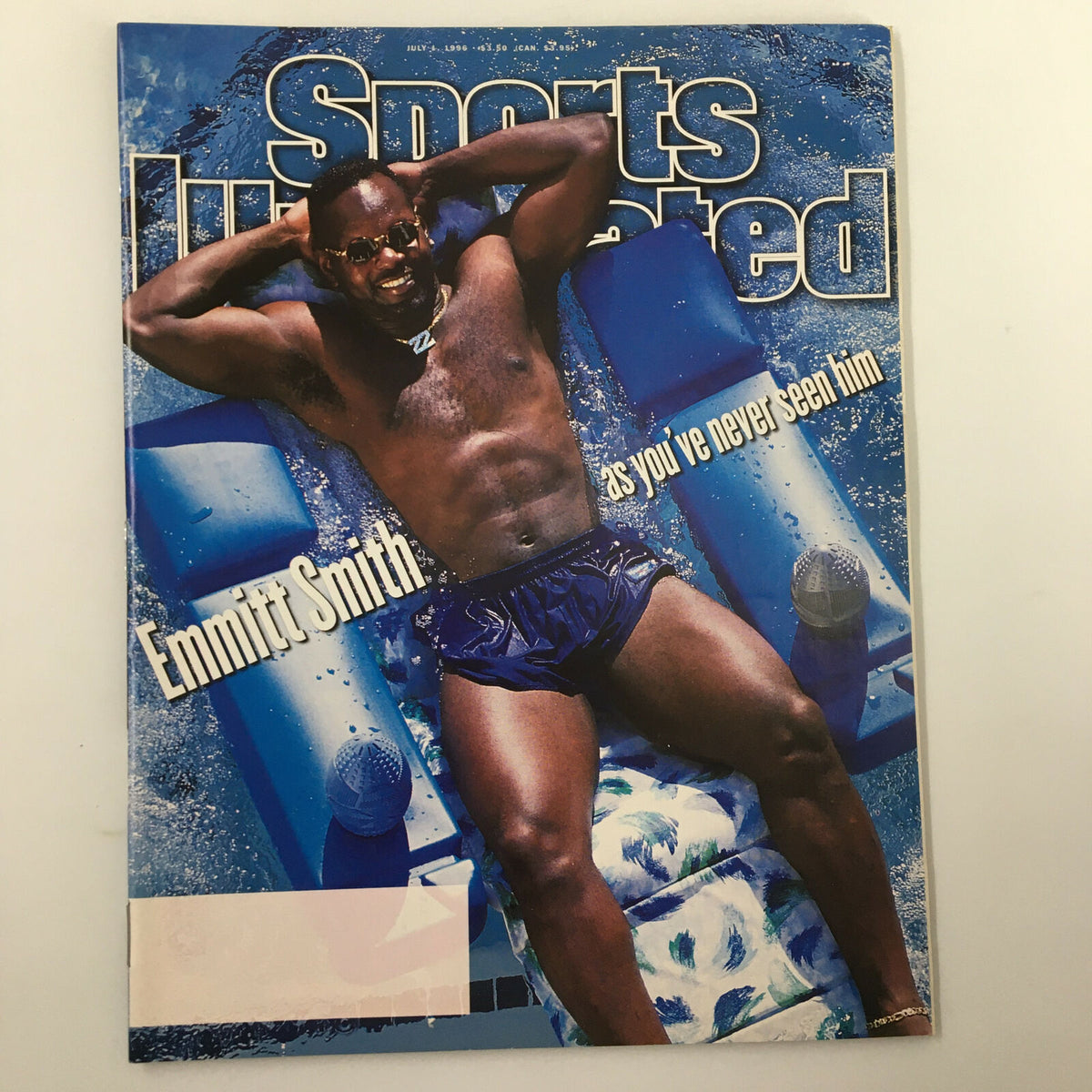 Cover of Sports Illustrated Magazine, July 1, 1996, featuring Emmitt Smith relaxing in a pool with the headline 'Emmitt Smith as you’ve never seen him.' Vintage collectible magazine in very good condition.