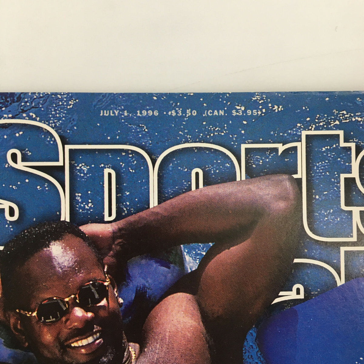 Sports Illustrated Magazine July 1 1996 - Emmitt Smith Cover featuring the legendary NFL player relaxing with a stylish look, capturing a nostalgic moment in sports history.