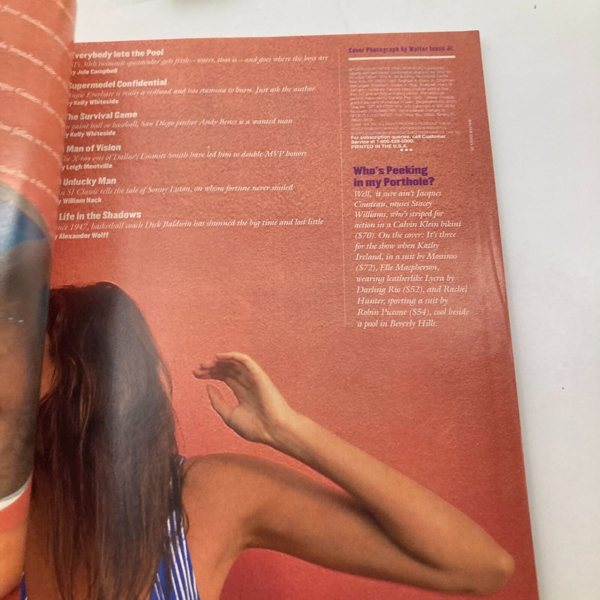 Inside page of Sports Illustrated Magazine February 14, 1994 featuring an article on Kathy Ireland, showcasing her in a fashion photo shoot by the pool, highlighting the iconic fashion trends of the 90s.