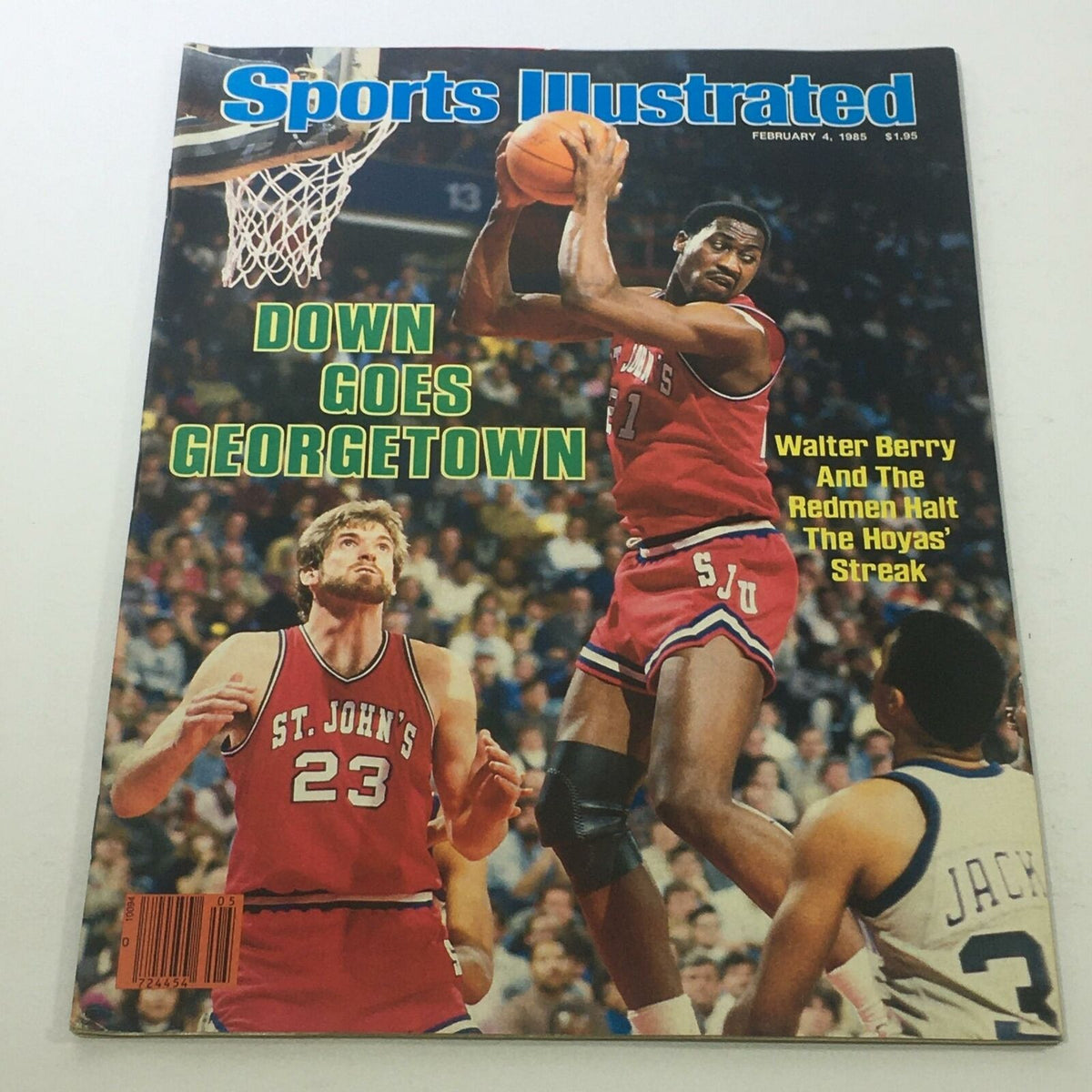 Sports Illustrated cover from February 4, 1985, featuring Walter Berry of St. John's University jumping to score against Georgetown, with the headline 'Down Goes Georgetown.'