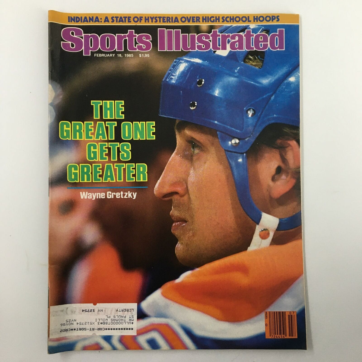 Cover of Sports Illustrated Magazine from February 18, 1985, featuring Wayne Gretzky, known as 'The Great One'. The cover highlights an image of Gretzky in a hockey helmet, showcasing the headline 'THE GREAT ONE GETS GREATER'. This vintage magazine is a collectible item in very good condition.