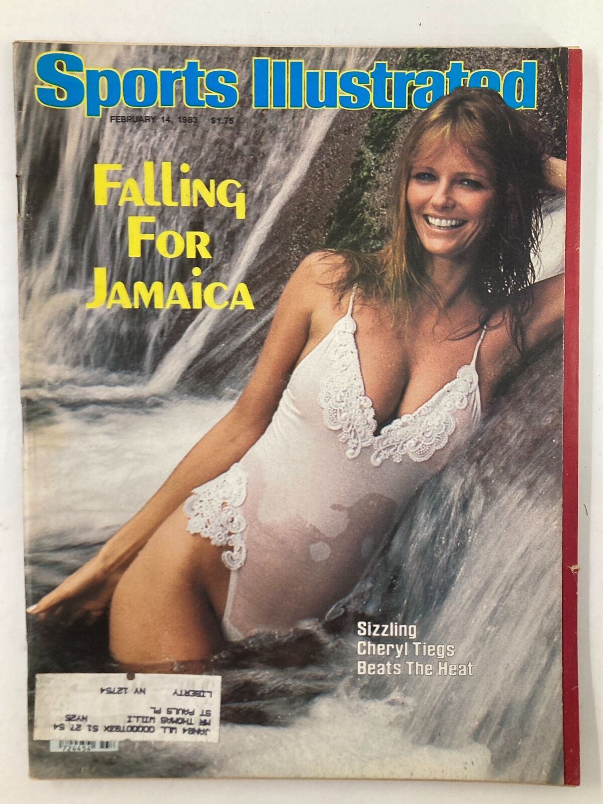 Vintage Sports Illustrated Magazine cover from February 14, 1983, featuring Cheryl Tiegs in a white swimsuit, with the headline 'Cheryl Tiegs Beats The Heat'.