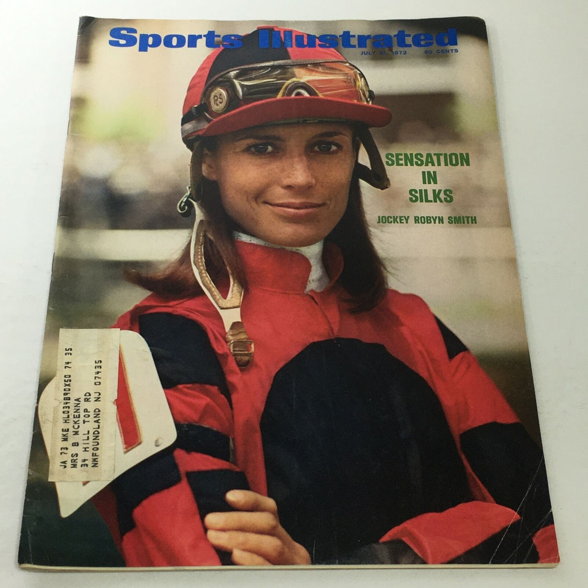 Cover of Sports Illustrated from July 31, 1972, featuring sensation in silks, jockey Robyn Smith, with a colorful image highlighting her racing attire and framed by the iconic magazine branding.