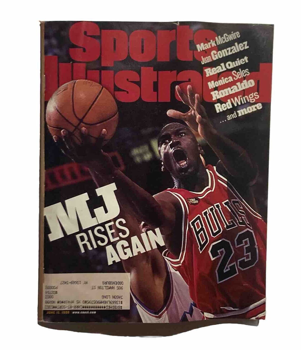 Sports Illustrated Magazine cover from June 15, 1998, featuring Michael Jordan in a Chicago Bulls jersey, showcasing his iconic moment in basketball. The headline reads 'MJ Rises Again', capturing a significant moment in sports history alongside Mark McGwire.