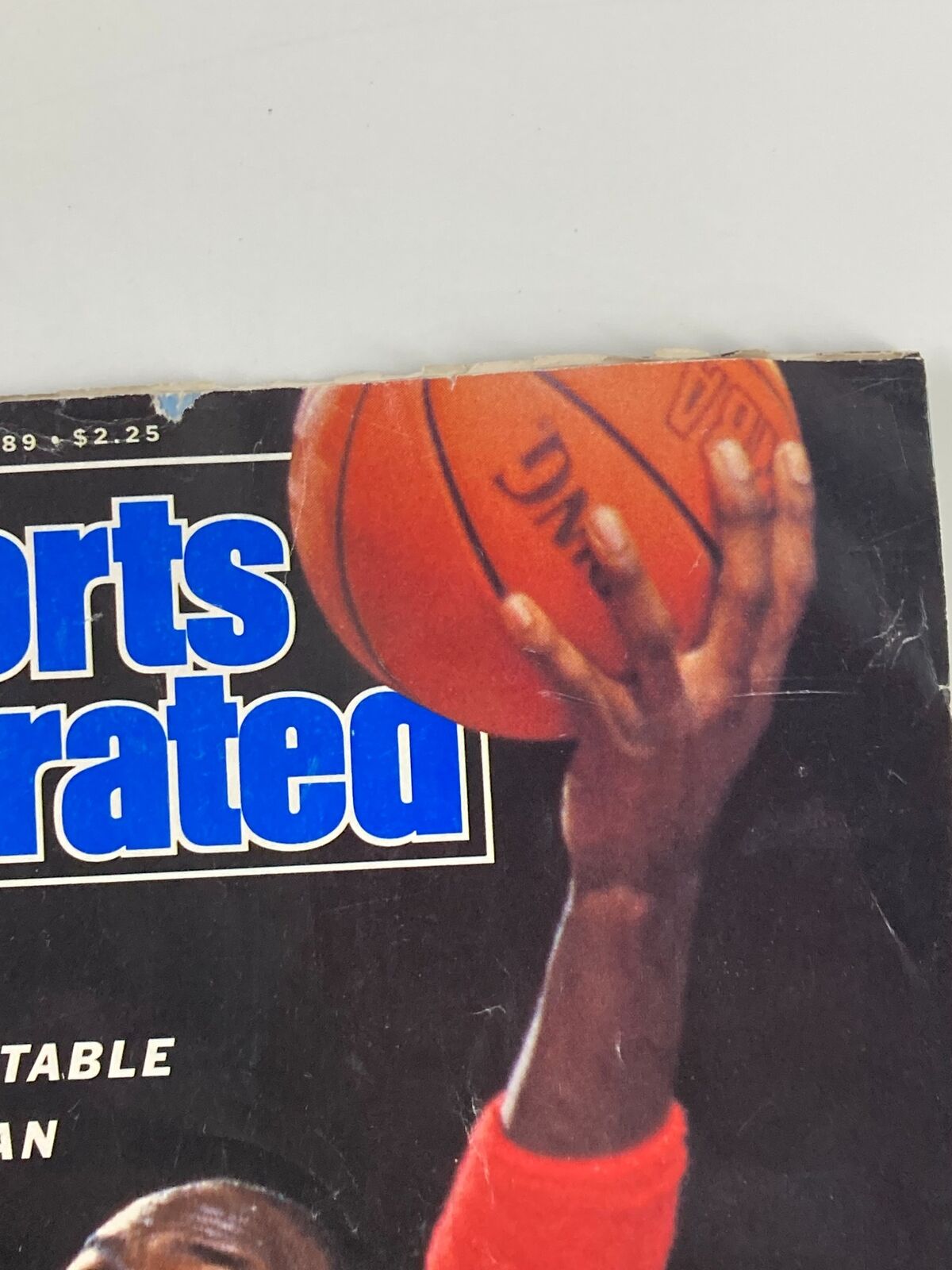 Top section of Sports Illustrated Magazine March 13 1989 cover with Michael Jordan capturing a basketball as part of the feature 'How High Can He Fly?'