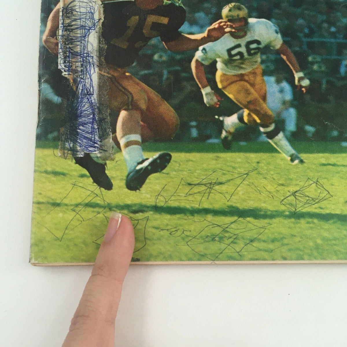 Close-up of the Sports Illustrated Magazine cover from October 9, 1967, highlighting Mike Phipps in action, with visible ink marks adding character.