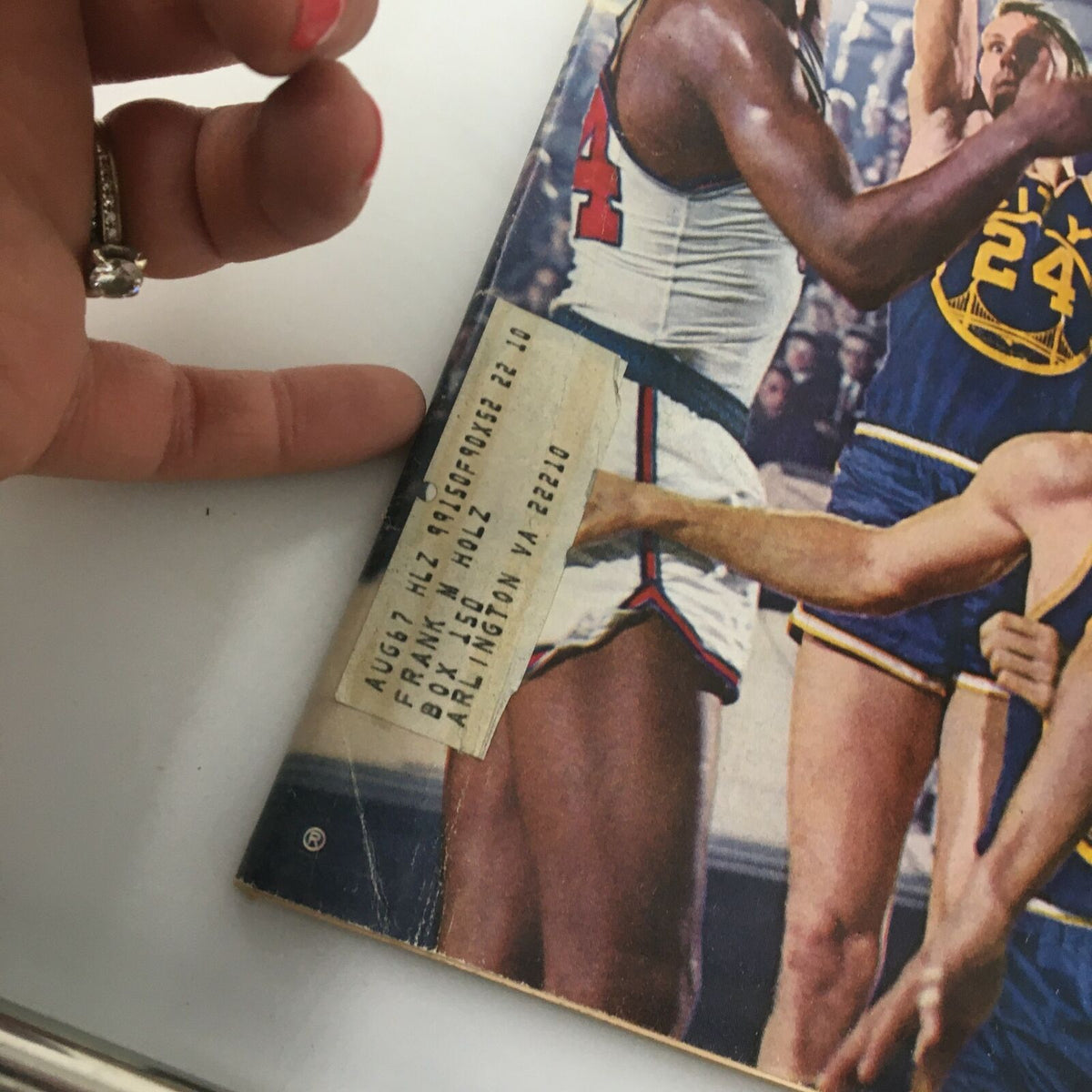 Close-up of the VTG Sports Illustrated Magazine April 24 1967 showing the side of the cover with a vintage mailing label, emphasizing its collectible authenticity.