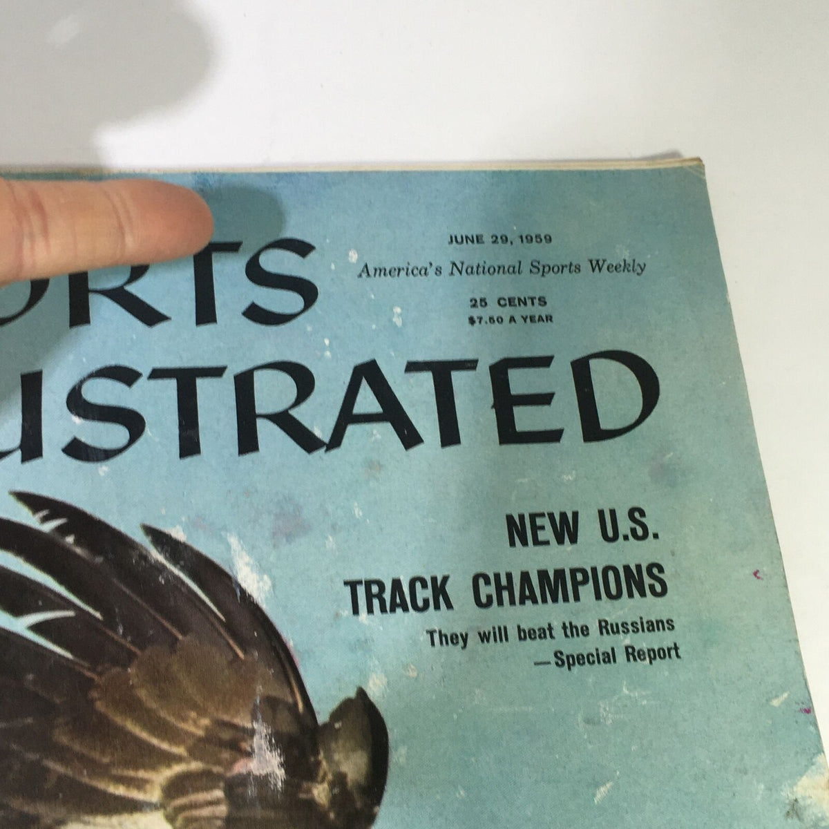 Close-up view of the Vtg Sports Illustrated Magazine June 29 1959 cover highlighting the issue's title and article features, including 'New U.S. Track Champions'.