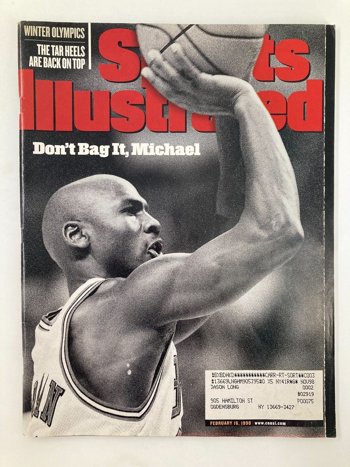 Cover of Sports Illustrated Magazine from February 16, 1998, featuring Michael Jordan of the Chicago Bulls, showcasing his basketball prowess with the headline 'Don't Bag It, Michael'.