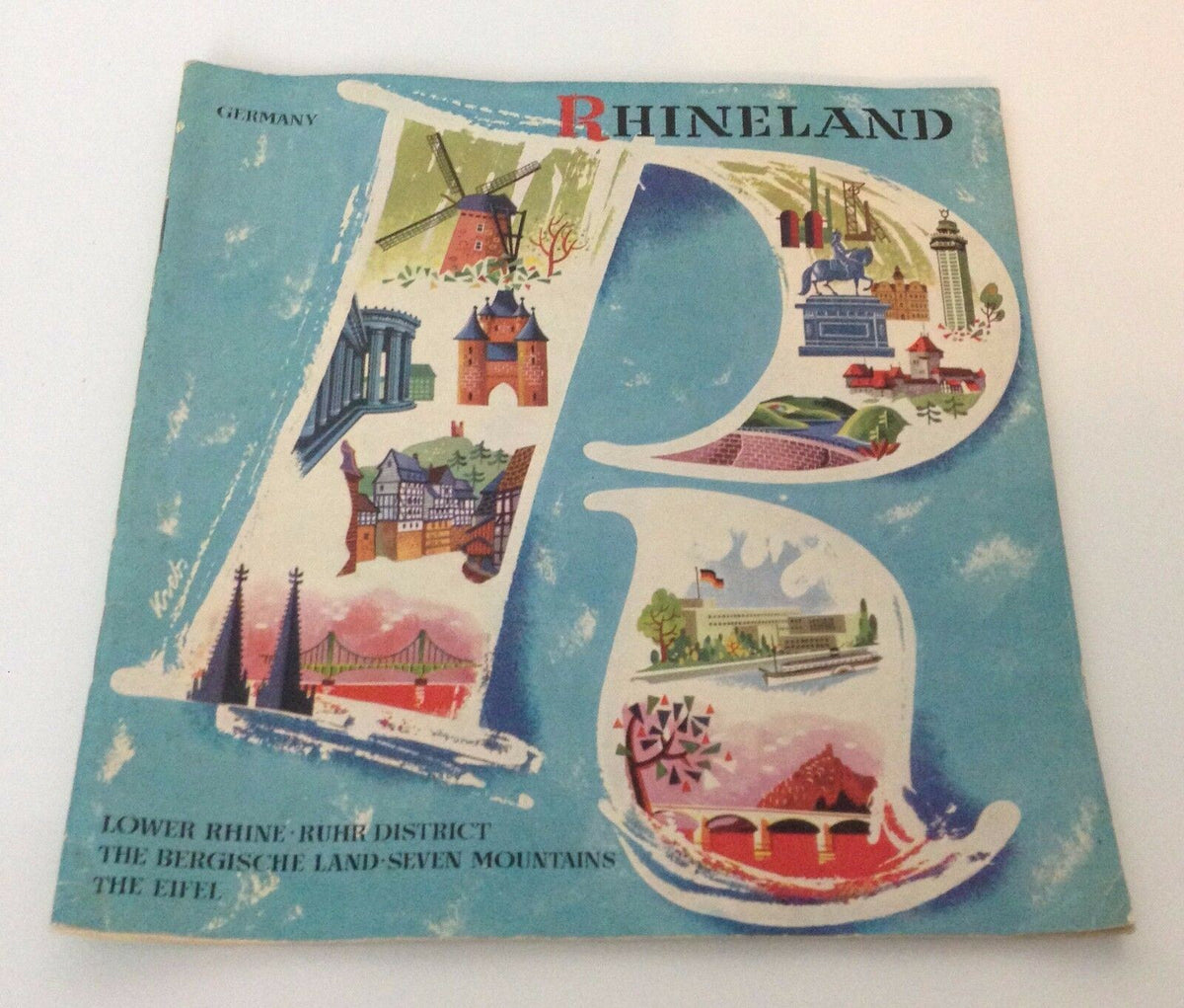 Another view of the Vintage 1950s GUIDE BOOKLET Rhineland Germany cover with prominent landmarks and artistic design elements.