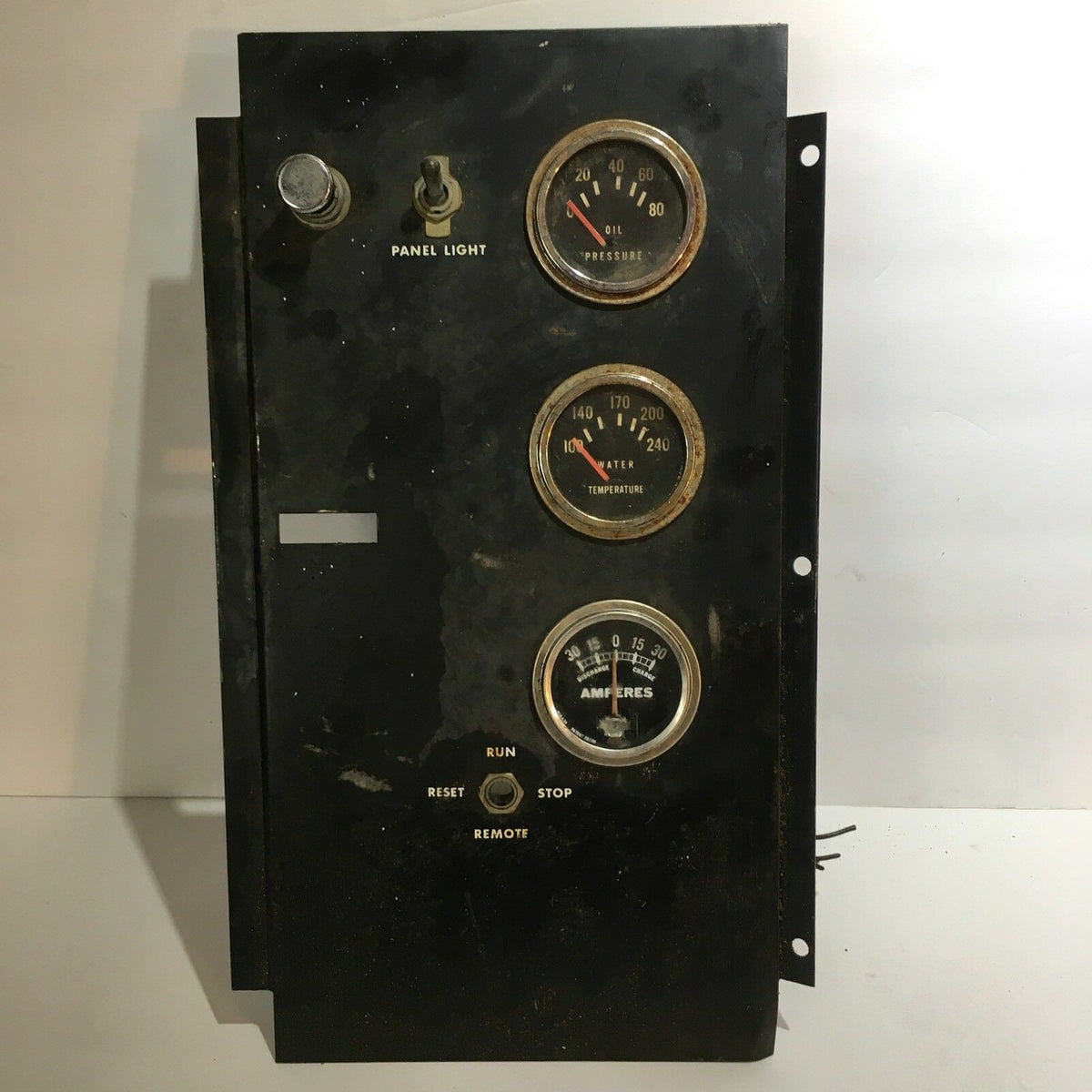 Temperature Water, Oil, Amps, Meter, Gauge Triple Auto Panel showcasing three gauges for pressure, temperature, and amperage indicators. The panel includes a reset button and a panel light switch, emphasizing its functionality for monitoring vital metrics.