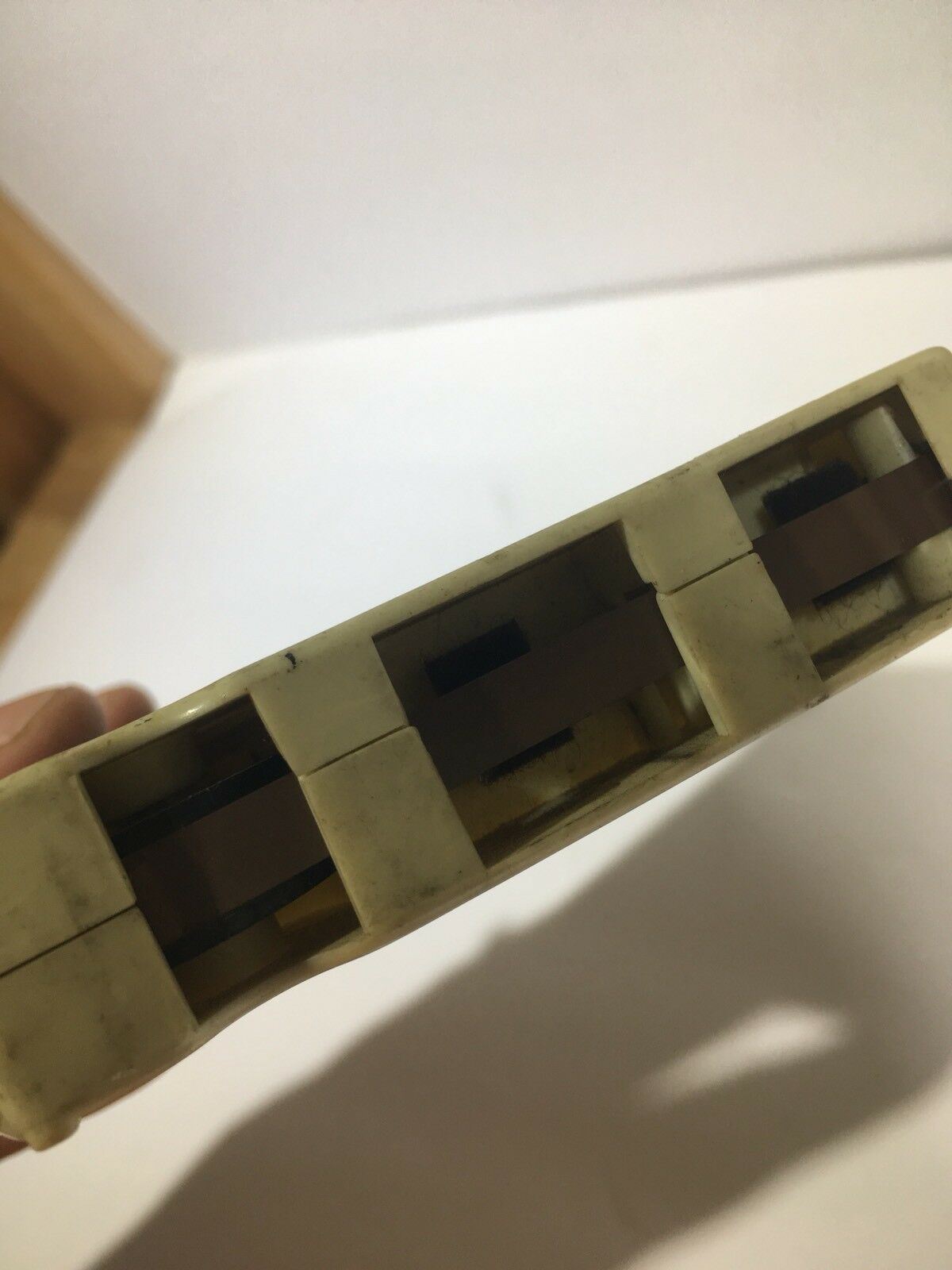 Side view of the A Space In Time Ten Years After 8 Track Tape, highlighting the internal mechanism and structure of this rare collectible.