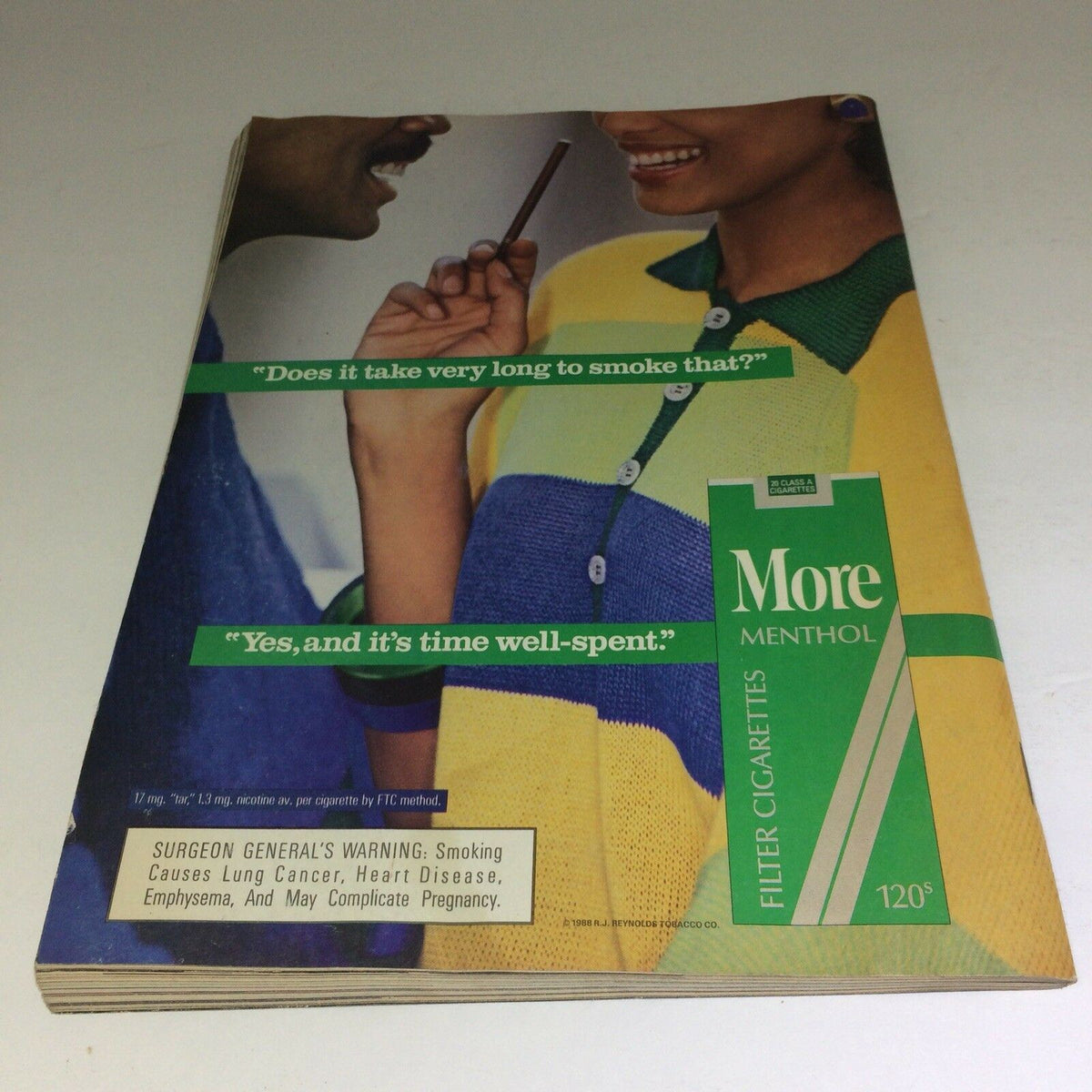 Back cover of the APRIL 1989 Vintage Ebony Magazine with an advertisement for More Menthol cigarettes featuring a couple engaged in conversation.