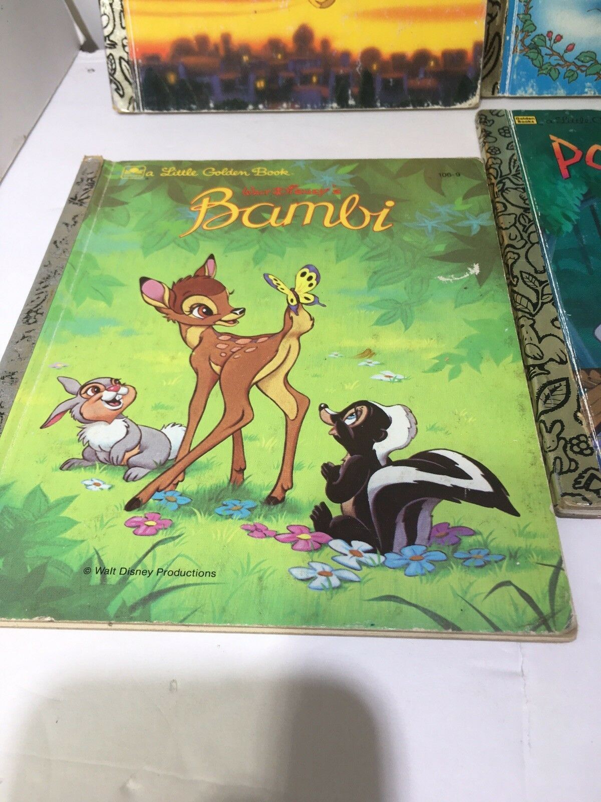 Little Golden Book Disney Bambi featuring Bambi, a young deer interacting with a butterfly, along with other woodland animals. Part of a classic children's book collection.
