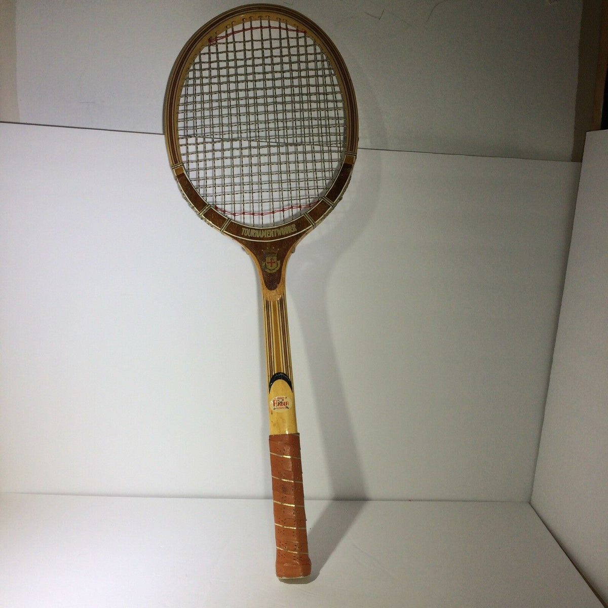Front view of the Vintage Tournament Wood Tennis Racket Ash Frame 9 Ply Andia, highlighting the classic design and string pattern.
