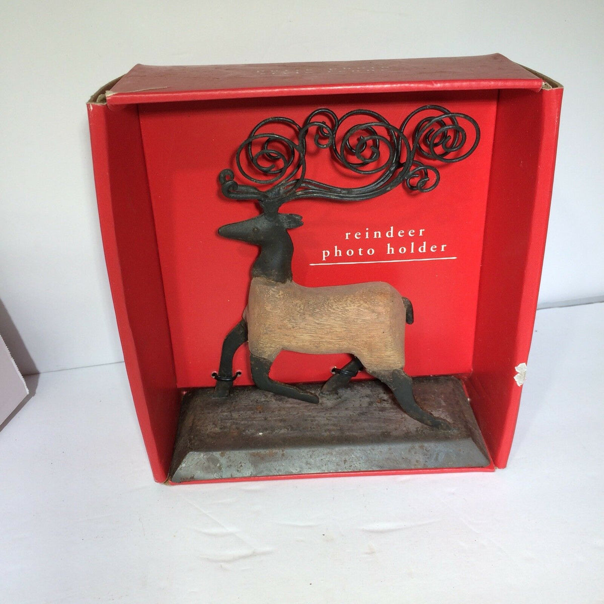 Pier1 Imports REINDEER Photo or Card Holder showcased in its original packaging, featuring a rustic deer design with artistic antlers, ideal for displaying holiday photos and cards.
