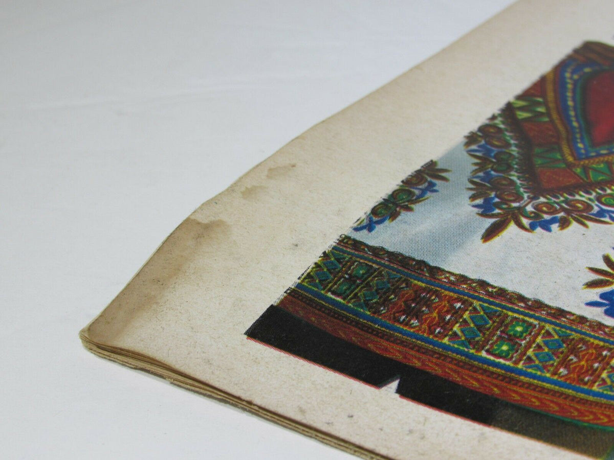 Close-up image of the back cover of Sepia Magazine, April 1970 edition, showcasing details of a decorative dashiki. The image highlights the intricate patterns and colors along with wear signs, emphasizing the vintage character of the fashion promotion.