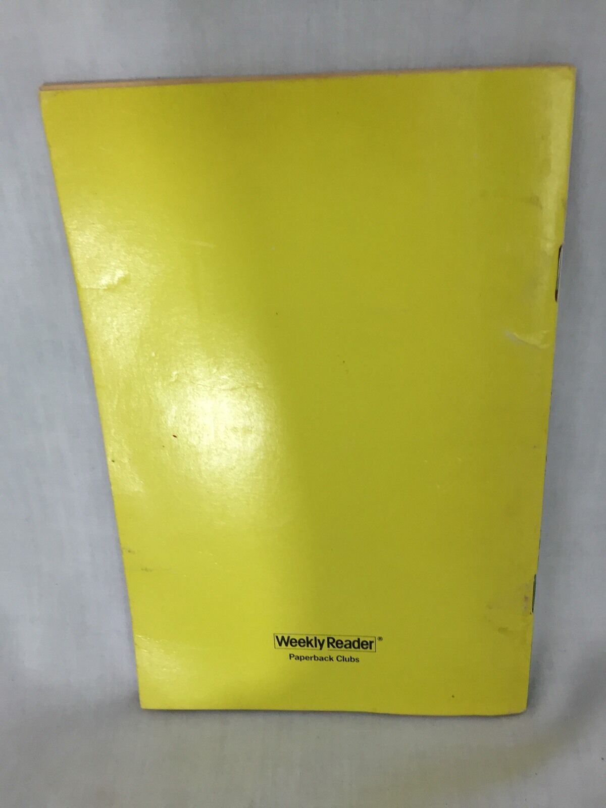Back view of the VTG 1980 'Popeye and the Haunted House' paperback book displaying the yellow cover with Weekly Reader branding.